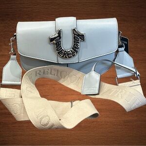 True Religion crossbody w/ signature logo accent. Light grey.